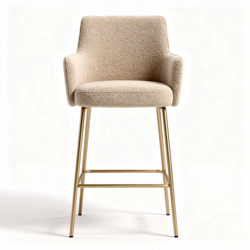 Upholstered bar height stool with gold metal legs and cream fabric finish